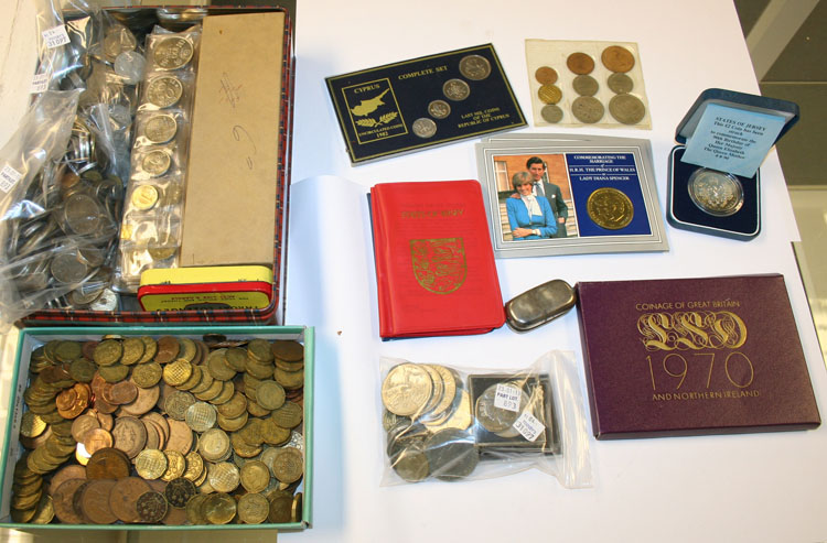 A quantity of British and foreign coins, including a two pounds coin, a one pound coin, twelve large