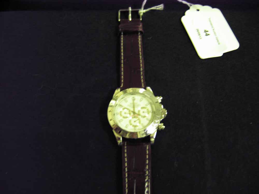 A replica Rolex Oyster Daytona 24 mens wristwatch with brown leather strap