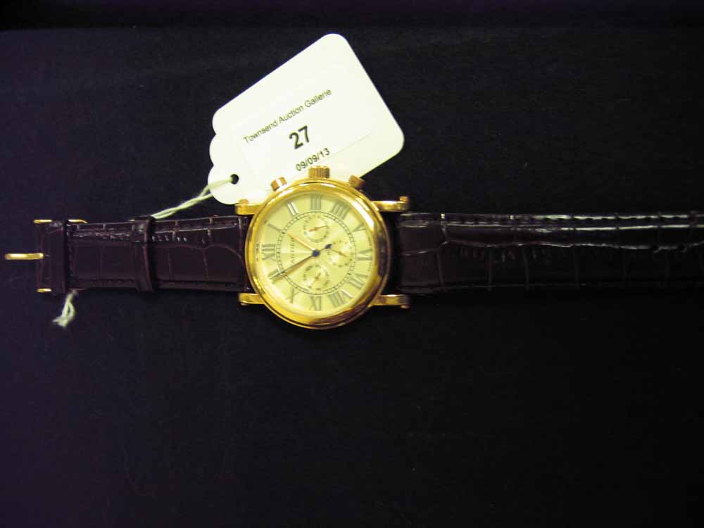 A replica Cartier cream & gilt mens wristwatch with day date & month dials