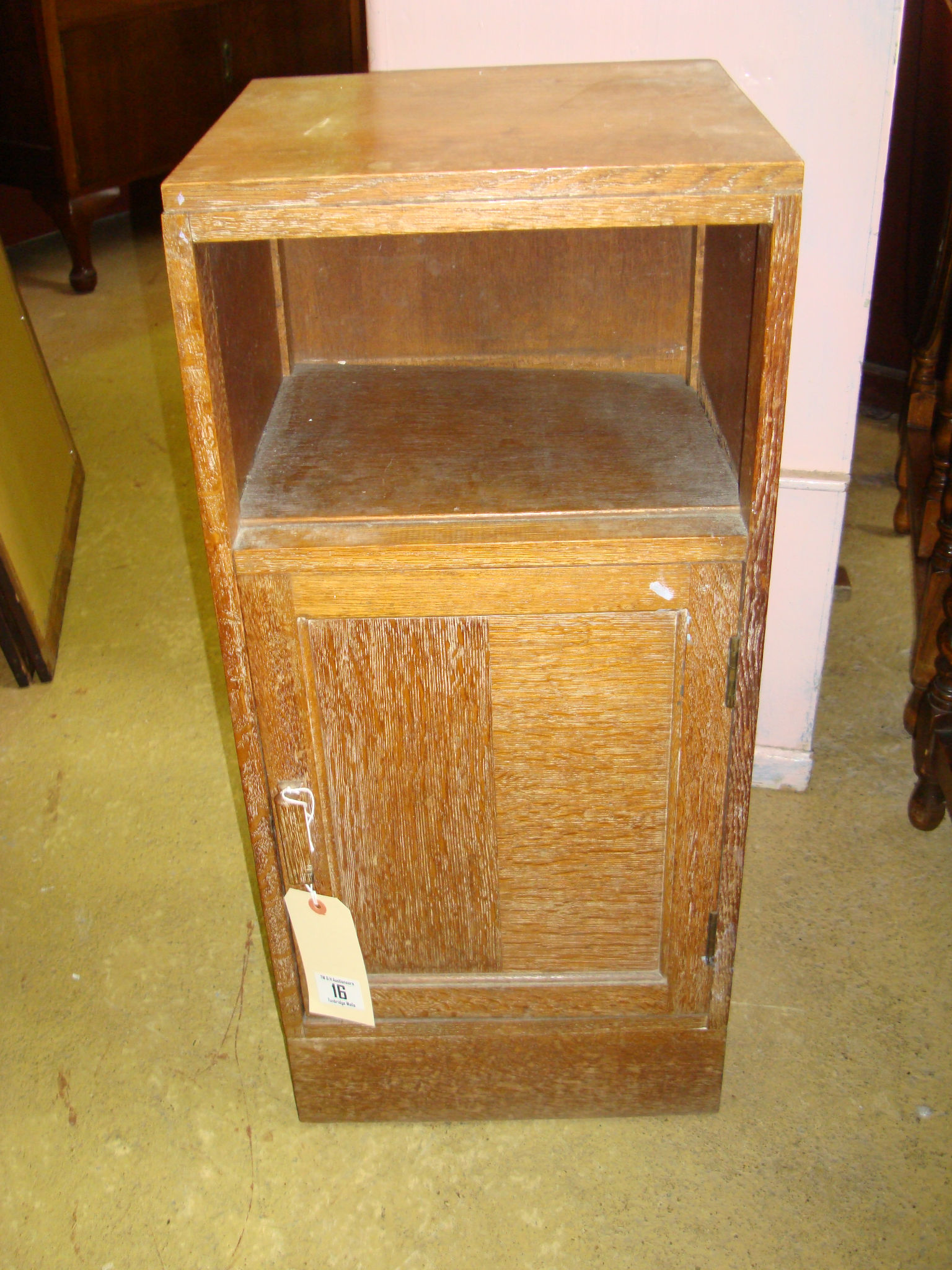 An early 20th century oak bedside cupboard