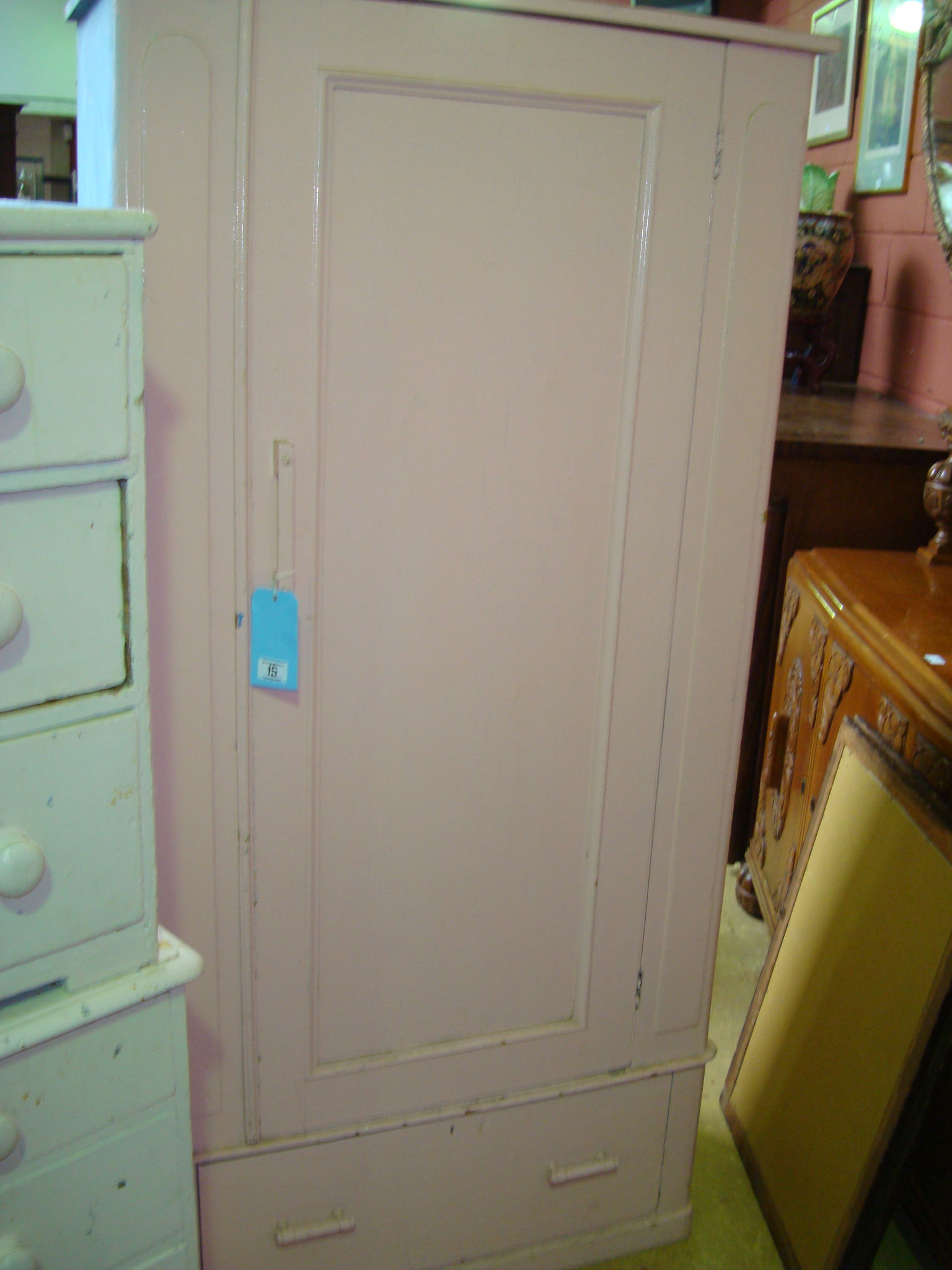 A pink painted pine wardrobe