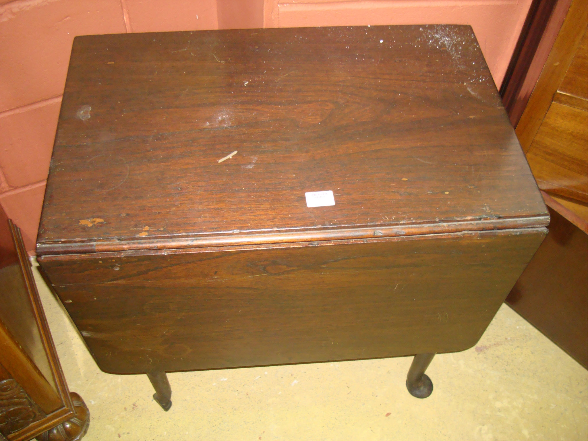 An 18thC single drop leaf mahogany table one short drawer raised on four pad feet, adapted.