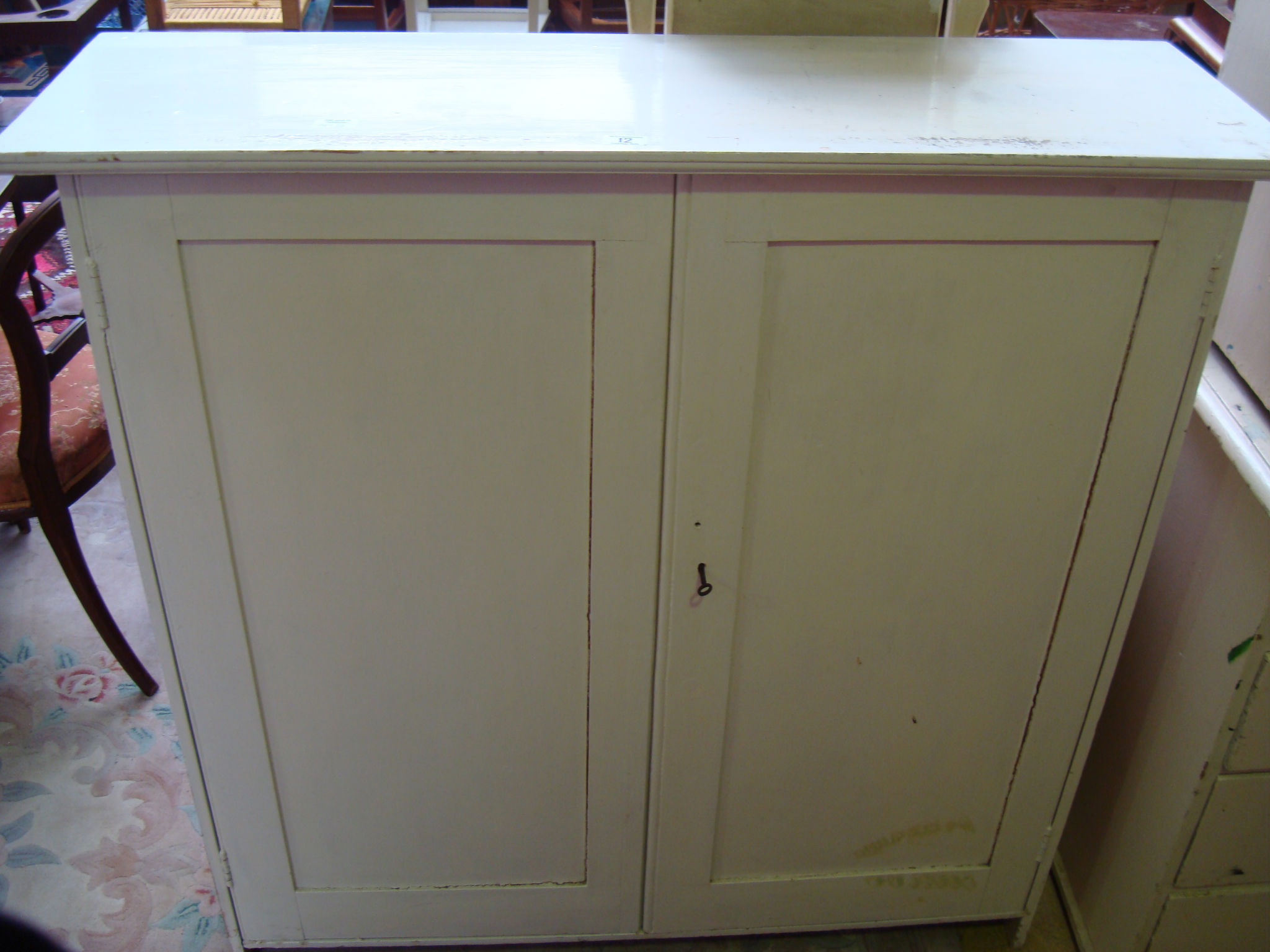 A white painted pine cupboard