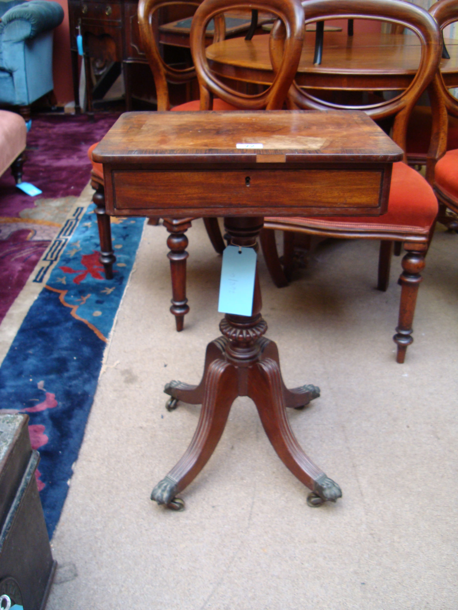 A Regency mahogany work table crossbanded with rosewood