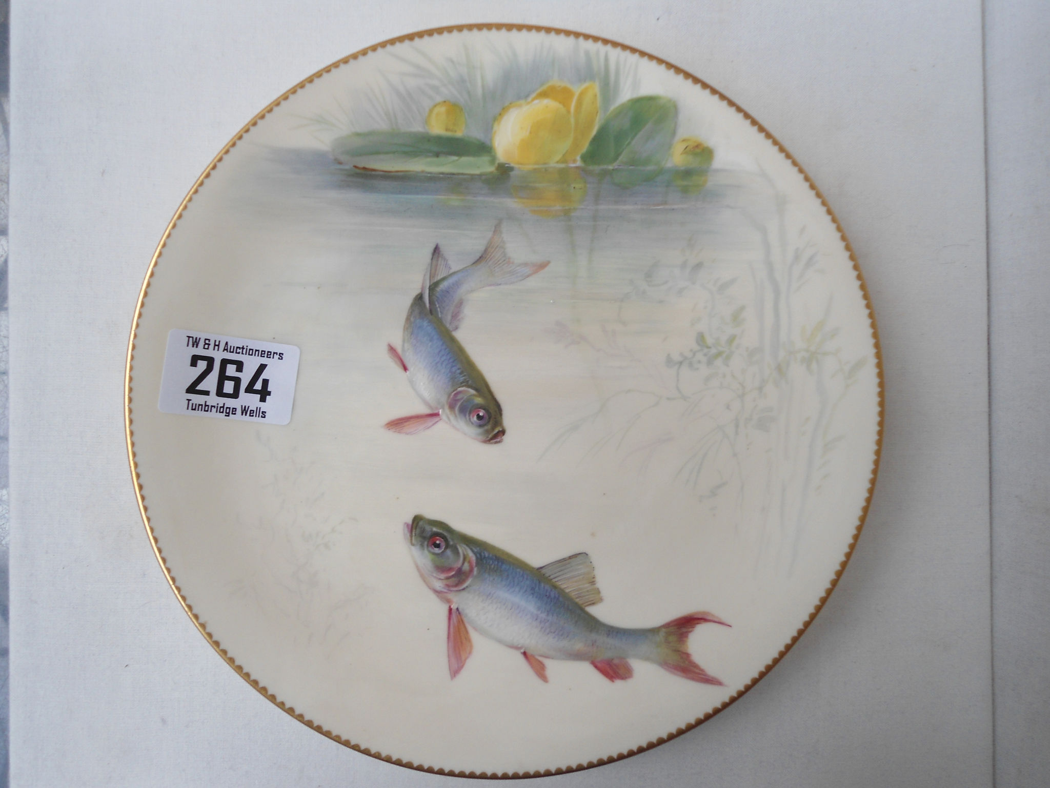 A Mintons hand painted cabinet plate, depicting minnows, c.1900