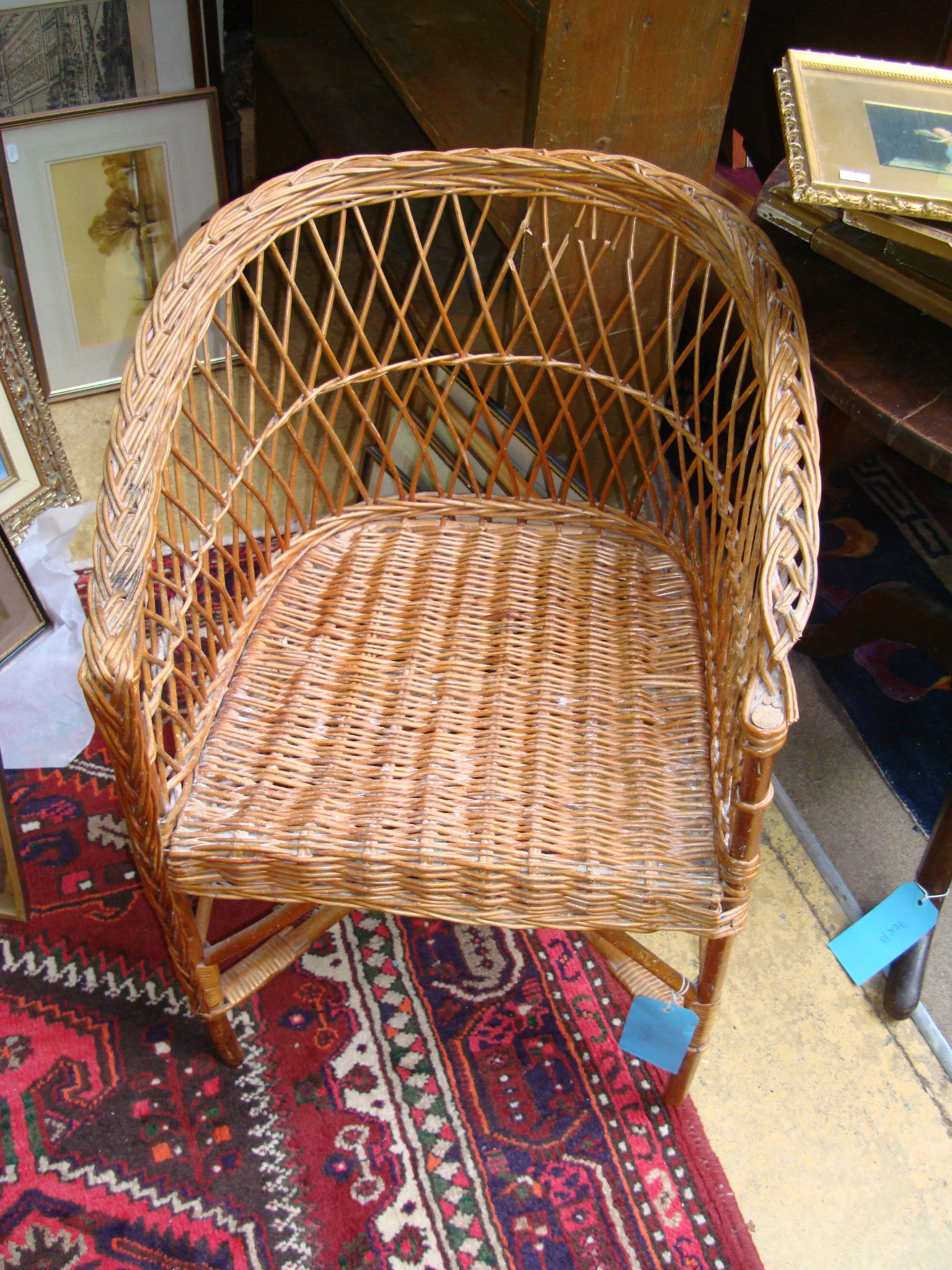 A wicker armchair and laundry basket