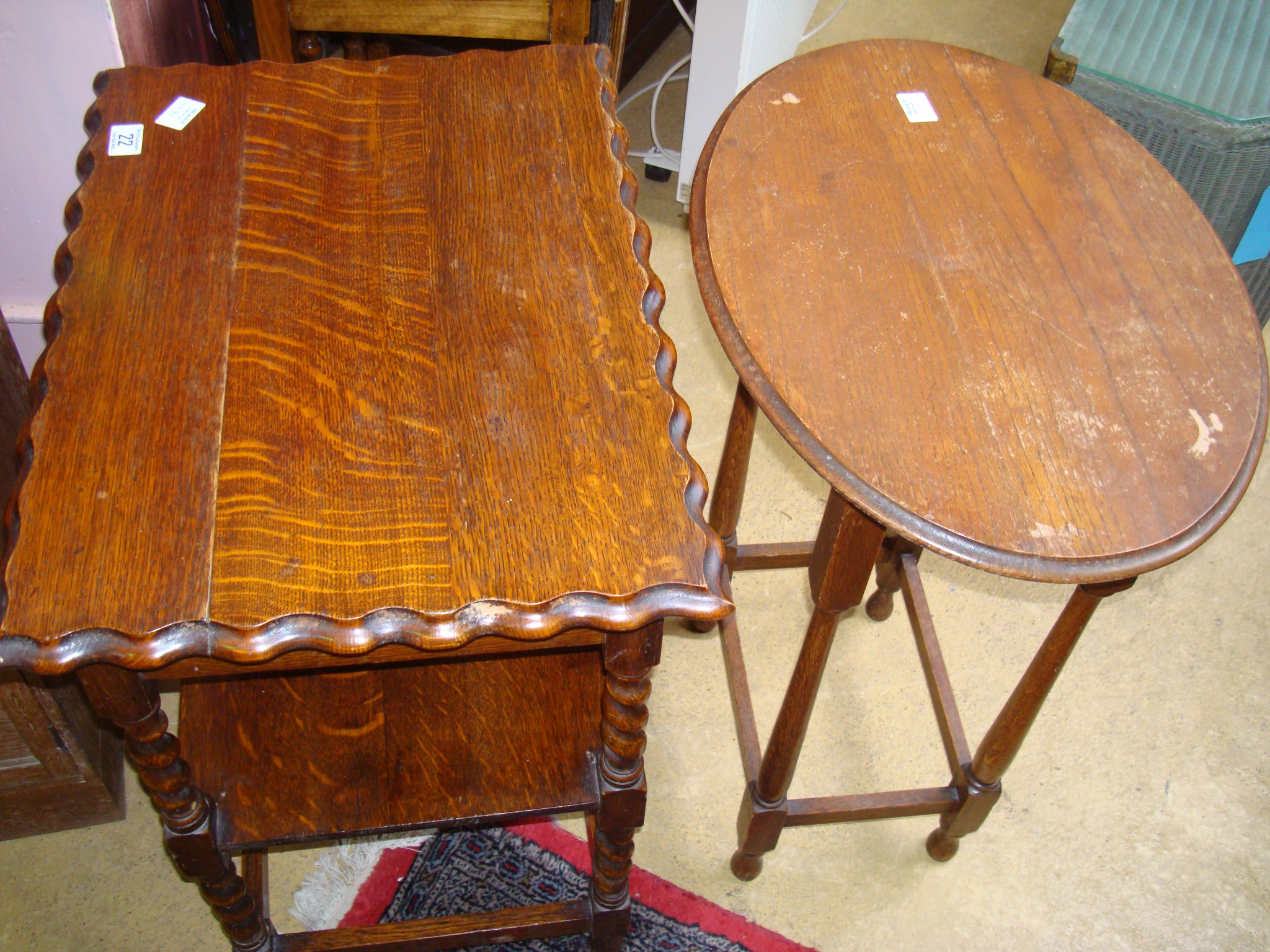 A 1930s oak occasional table and another