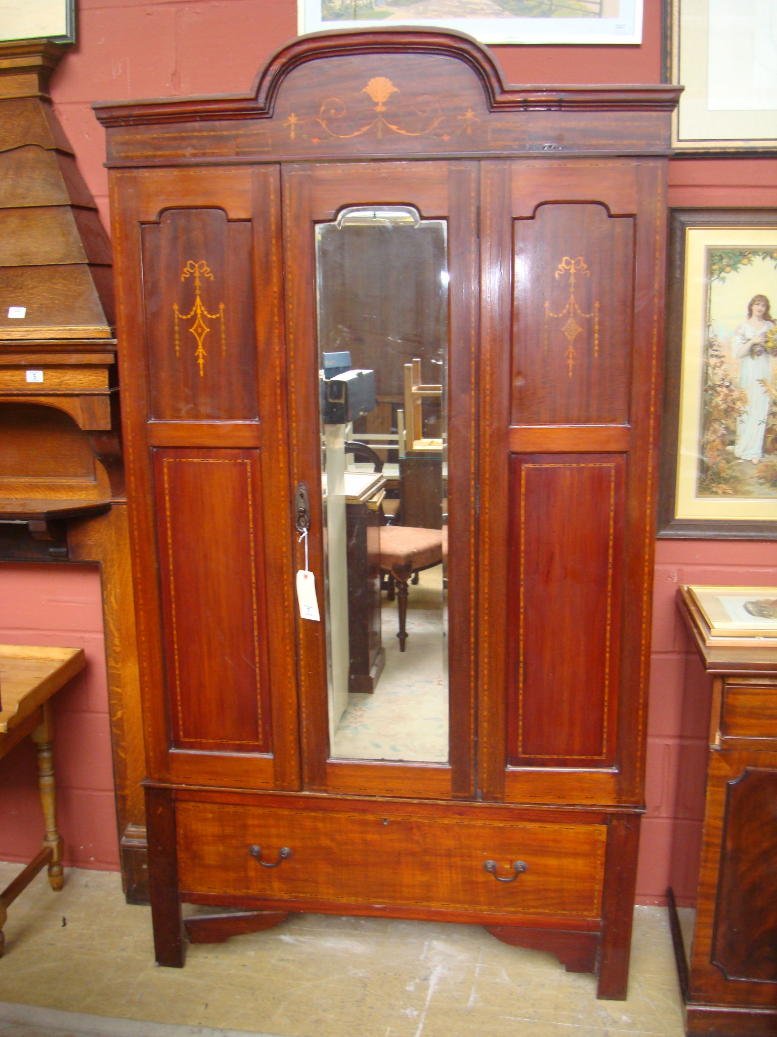 An Edwardian inlaid mahogany wardrobe