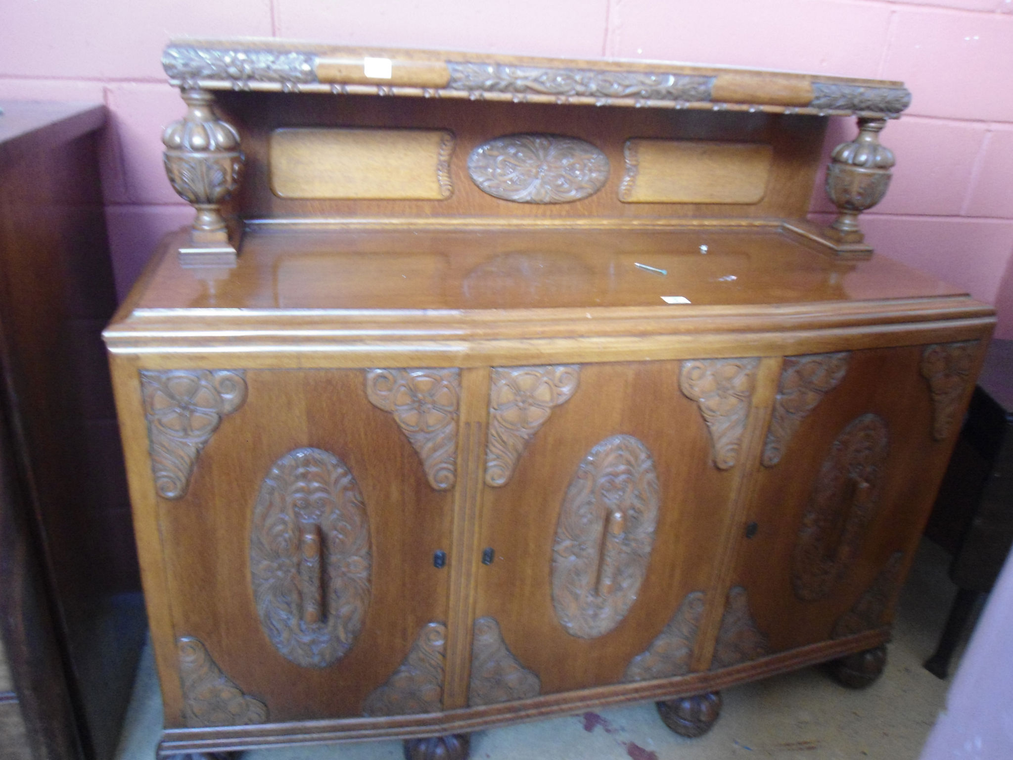 A 1930s oak sideboard