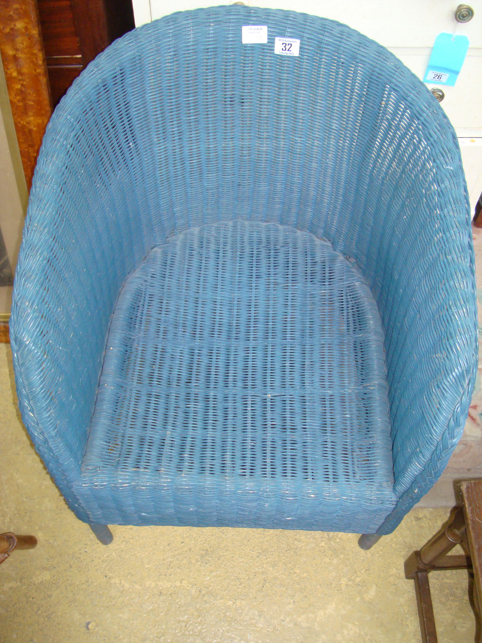 A Lloyd Loom style blue painted armchair