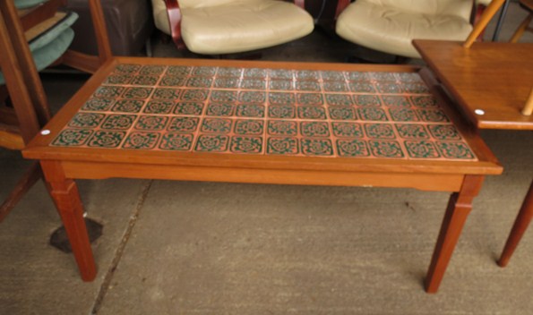 A Danish Teak coffee table with abstract design tiles, stamped 'Made in Denmark'