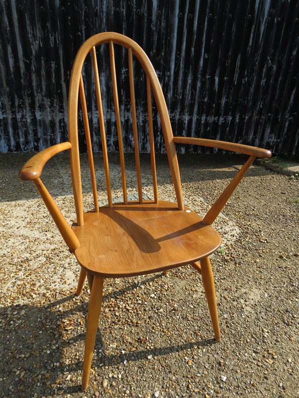 A 1960s ercol light elm and beechwood armchair