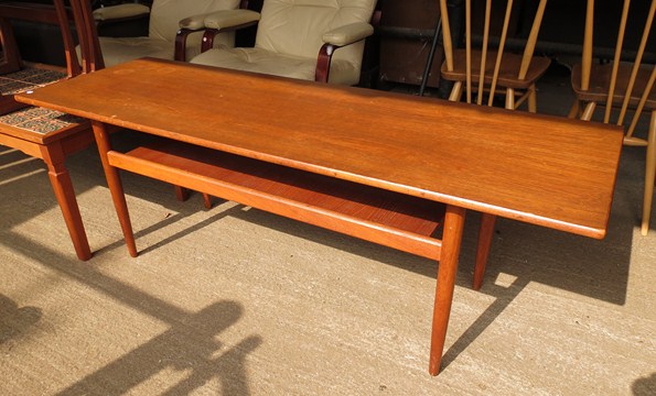 A 1960s teak rectangular coffee table with undertier