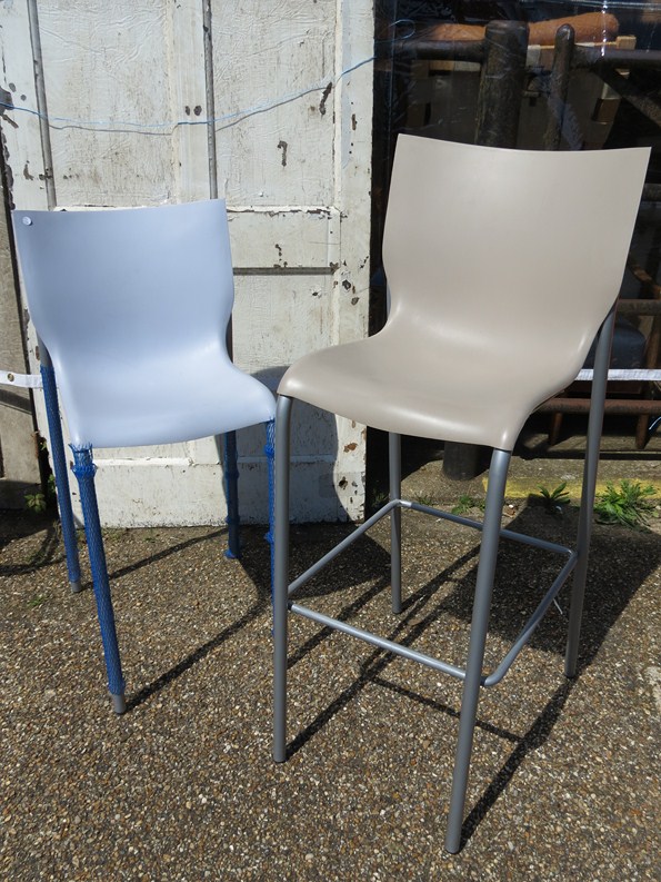 Two Phillipe Starck design moulded plastic bar stools