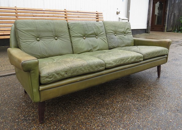 A green leather three seater Skippers Mobler sofa