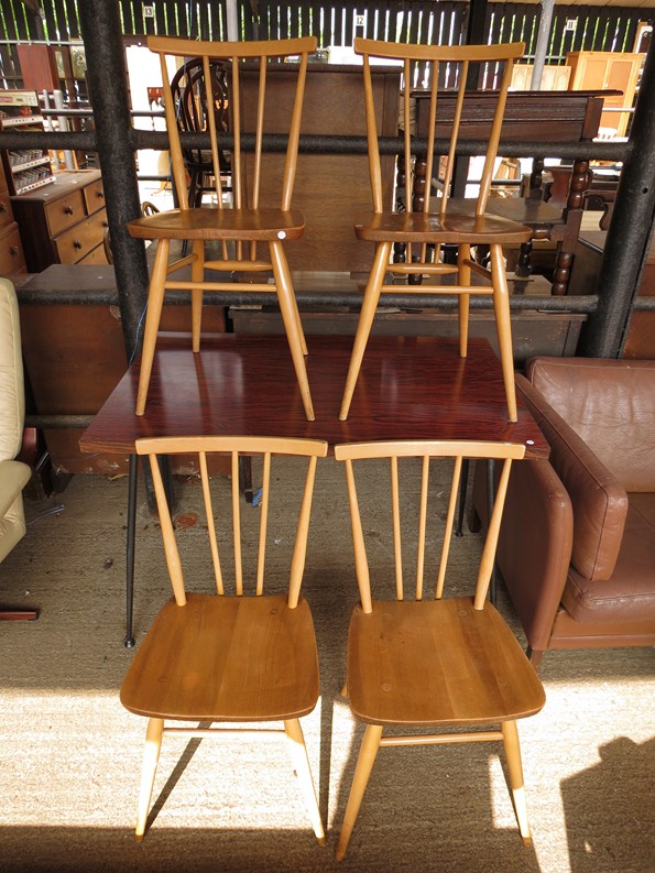 A set of four 1960s light elm Ercol dining chairs