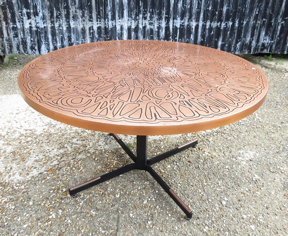 A Ilse copper topped coffee table