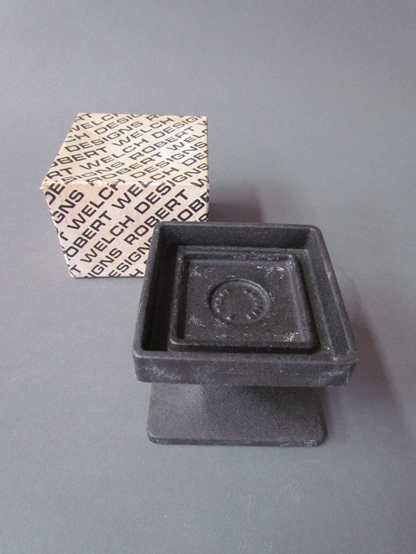 A Robert Welch iron candle holder in original box