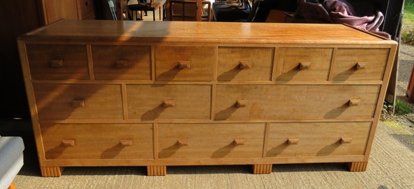 Betty Joel - a walnut bank of twelve drawers with stepped handles. Label verso, made by B.Worley and