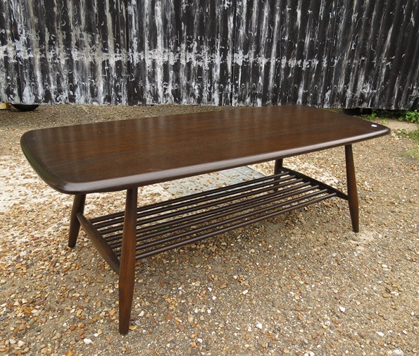 An Ercol dark finish coffee table with slatted under tier