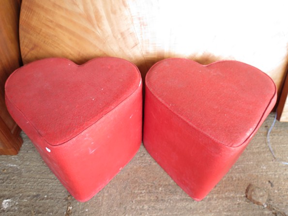 A pair of heart shaped red vinyl covered stools, originally came from Chelsea Girl Boutique circa