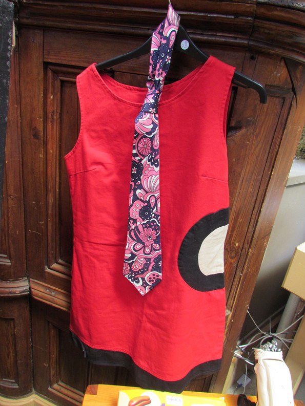 A 'Mwah' of London Mary Quant style mod mini dress and a Roberto of London 60's flower power tie
