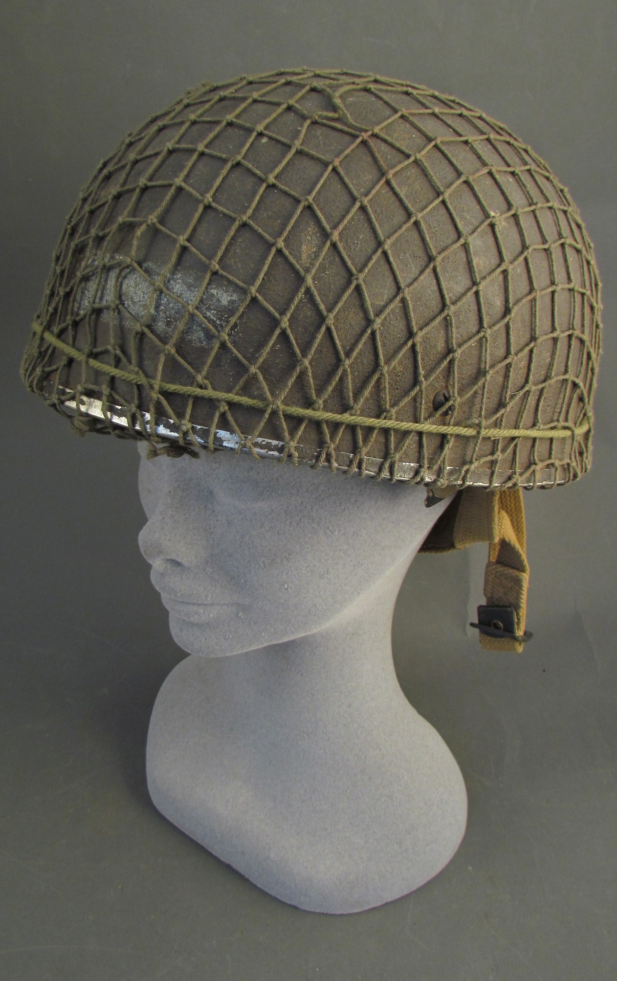 A post war British Airborne helmet size 73/8, with webbing