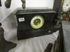 A black marble mantel clock