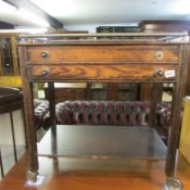 An oak cutlery trolley with cutlery