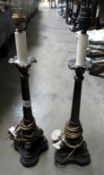 A pair of bronze effect table lamps