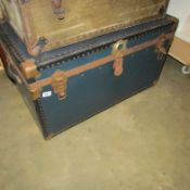 A large metal bound steamer trunk