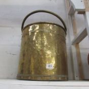 A large brass log bucket