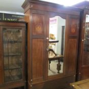 An Edwardian inlaid wardrobe