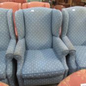 A blue wing armchair