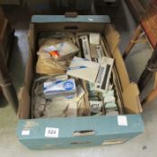 A box of miscellaneous watch batteries etc