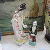 A Geisha figure and one other