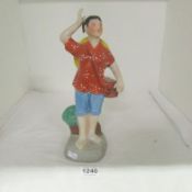 An Oriental Cultural revolution figure (marks on underside)