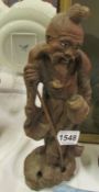A carved wood Chinese figure
