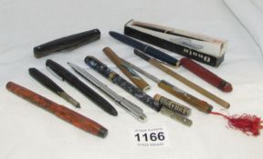 A mixed lot of vintage pens, letter opener etc