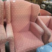 A pink wing armchair