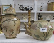 A matching brass teapot and vase