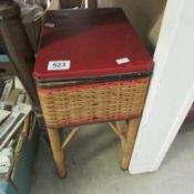 A wicker sewing basket/stool