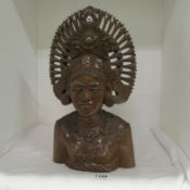 An ornate carved wood bust of a Burmese lady (16")