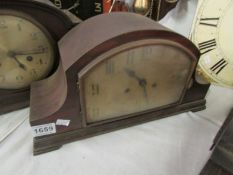 An oak mantel clock