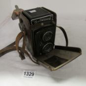 A leather cased Rollie cord camera