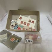 A mixed lot of loose stamps including penny reds