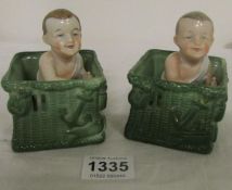 A pair of Victorian fairings being babies in baskets