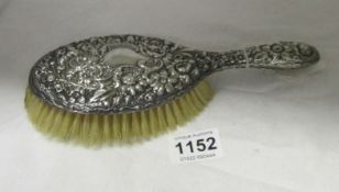 A silver backed hairbrush