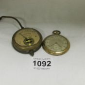 A pocket watch and a voltmeter