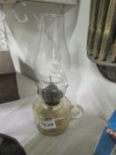 A glass hand oil lamp